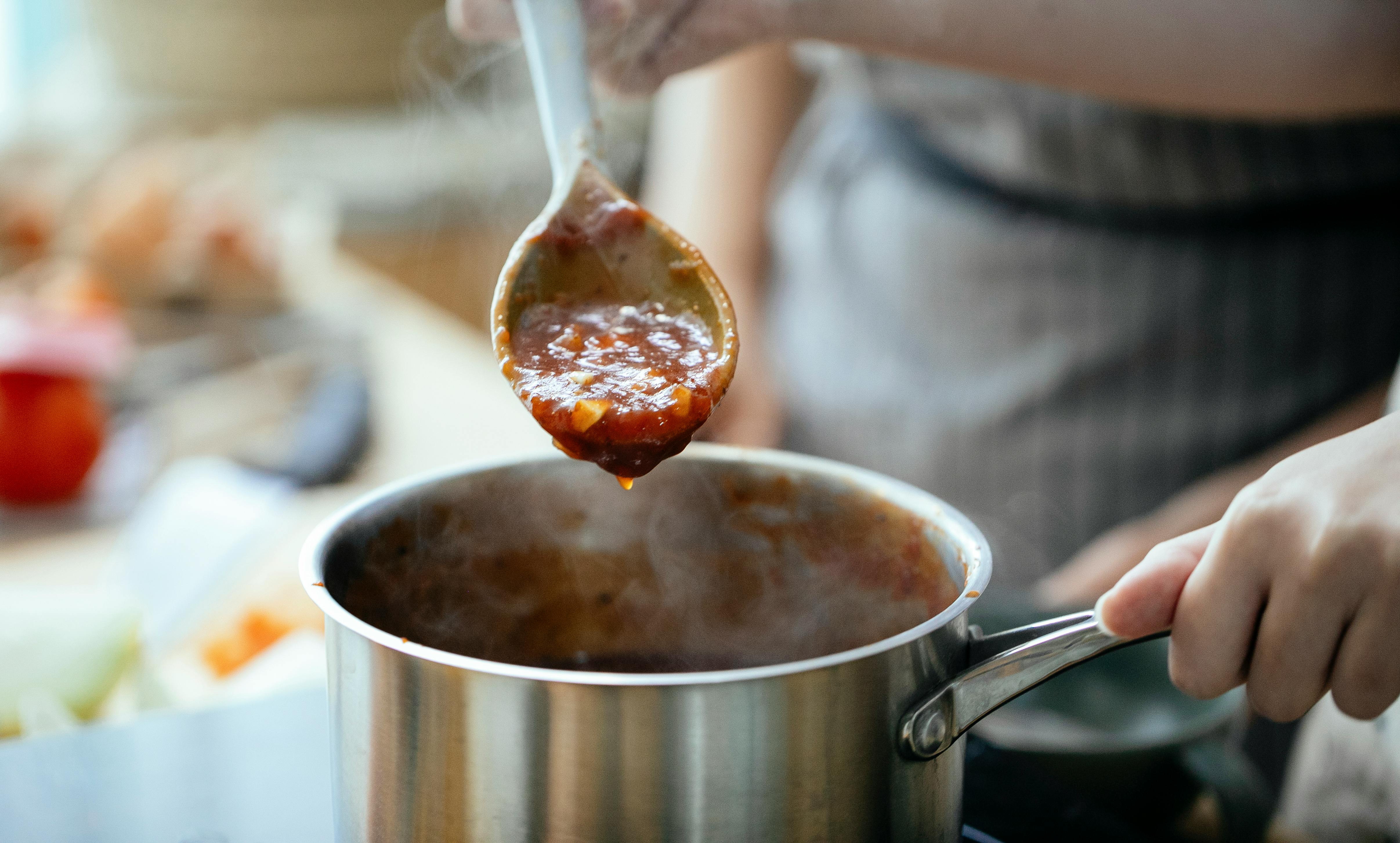 Home cooks preparing food together in a modern kitchen