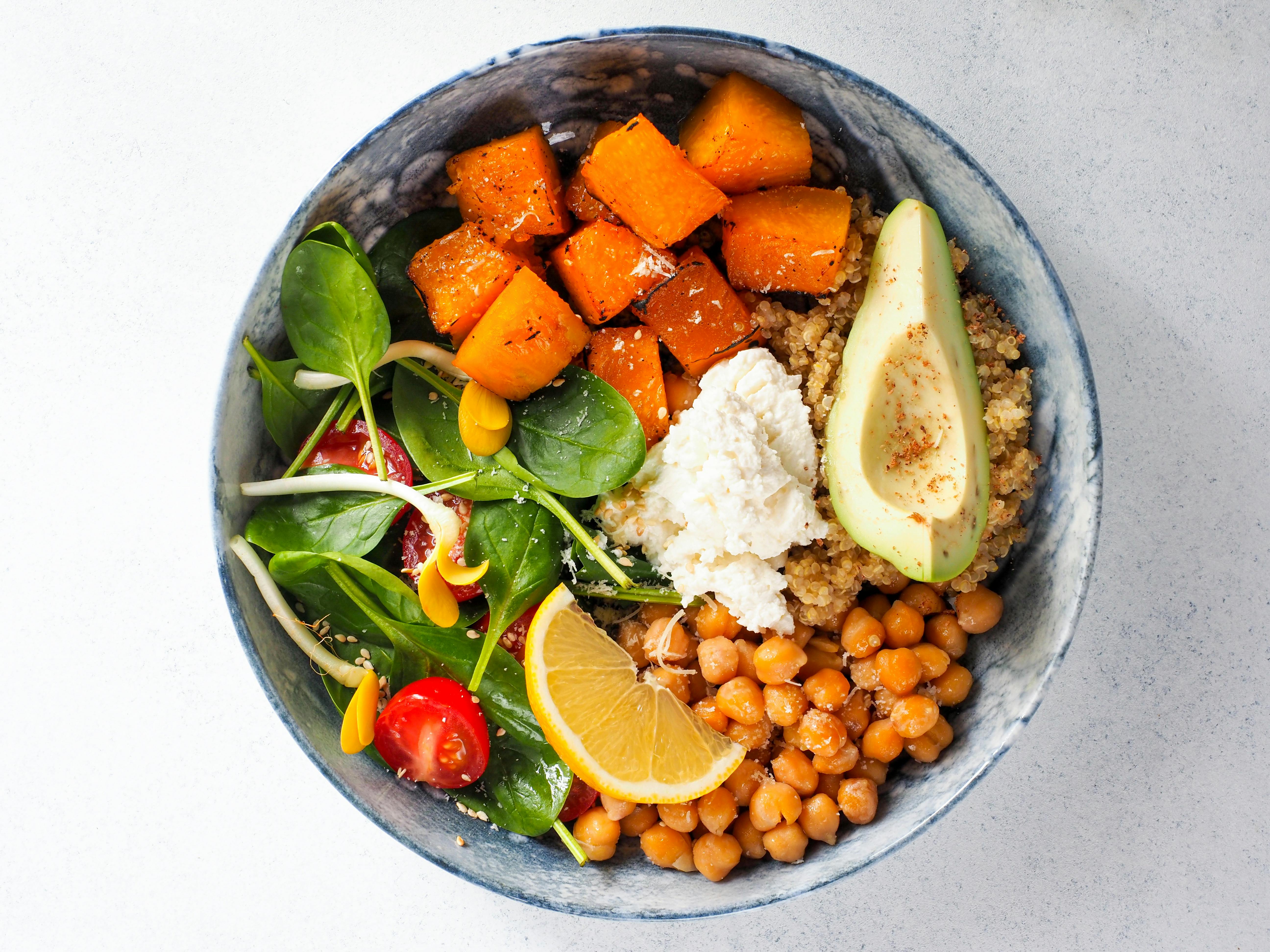 No cook summer meals - colorful Mediterranean chickpea bowl on a white plate