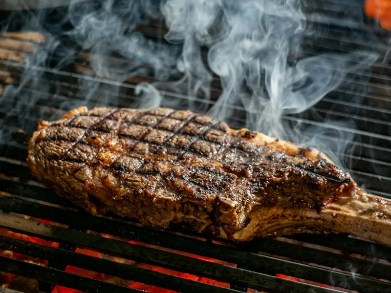 Sliced steak on a cutting board